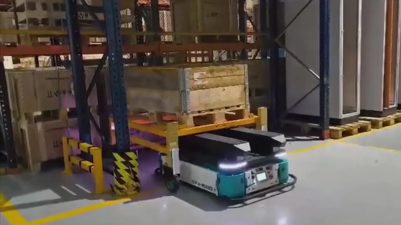 A GOAT robot carrying a rack across a warehouse during a live deployment