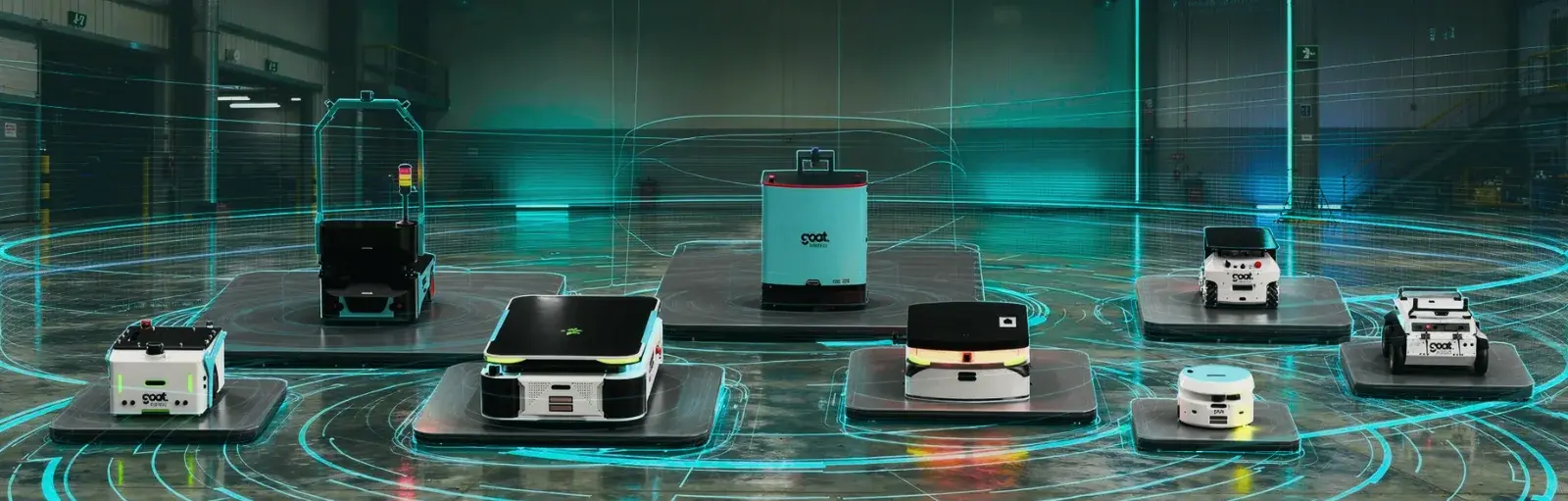 GOAT autonomous mobile robots carrying racks and pallets in a factory