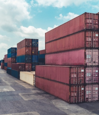 A cluster of cargo containers in a cargo  industry employs pallet truck in outdoor logistics.